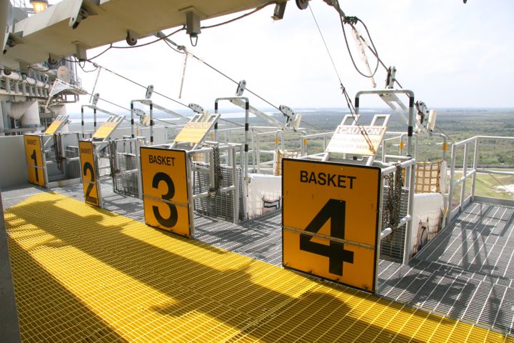 Emergency egress baskets...in case of emergency the astronauts jump in the baskets, pull a lever, and ride down cables...
