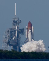 (T-5s) steam clouds envelope the shuttle